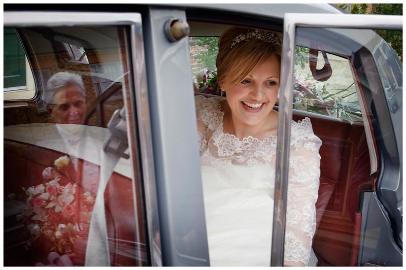 bride in car father reflected in window