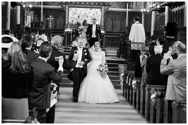 woburn abbey bride and groom walking down aisle