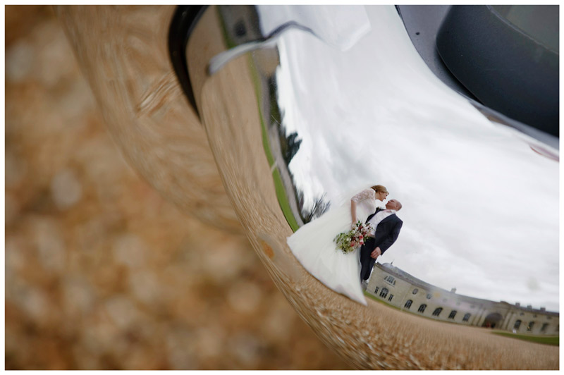 bride groom reflected in car bumper at Woburn Sculpture Gallery