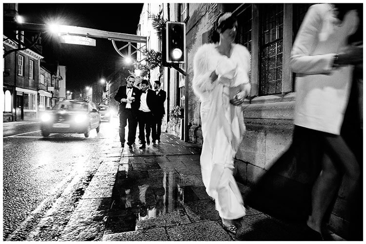 wedding guests walking stamford streets at night