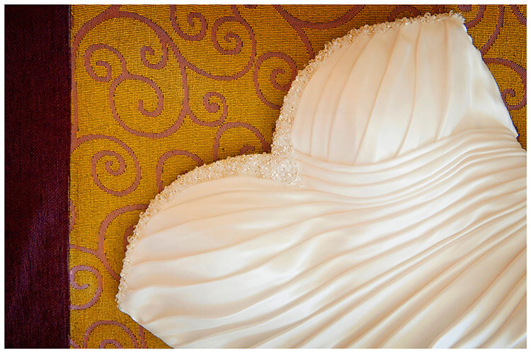 lake garda wedding photography bridal dress on colourful bed