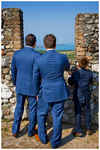 lake garda wedding photography groom and ushers look out over lake