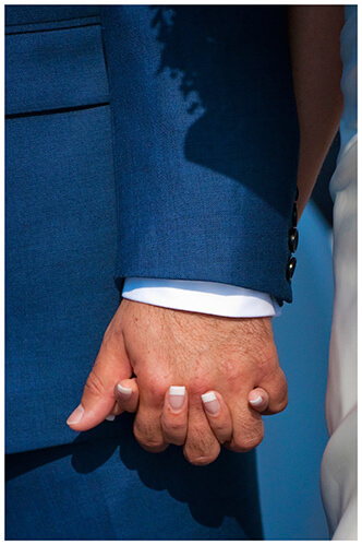 lake garda wedding photography bride groom holding hands during ceremony