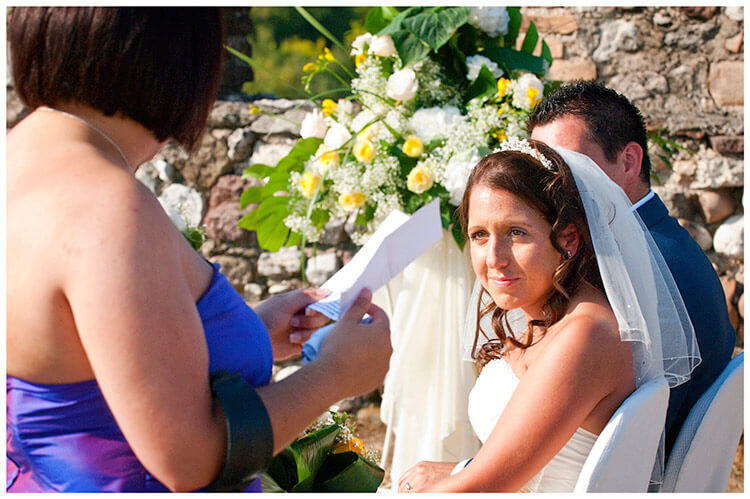 lake garda wedding photography bride looks at sister doing reading
