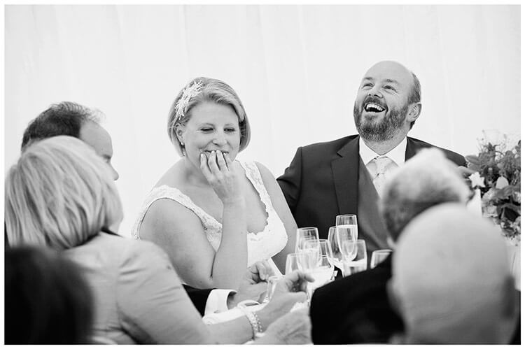 churchill college wedding laughing groom during speeches