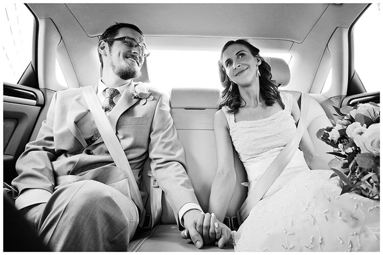 Michaelhouse wedding bride groom in car holding hands
