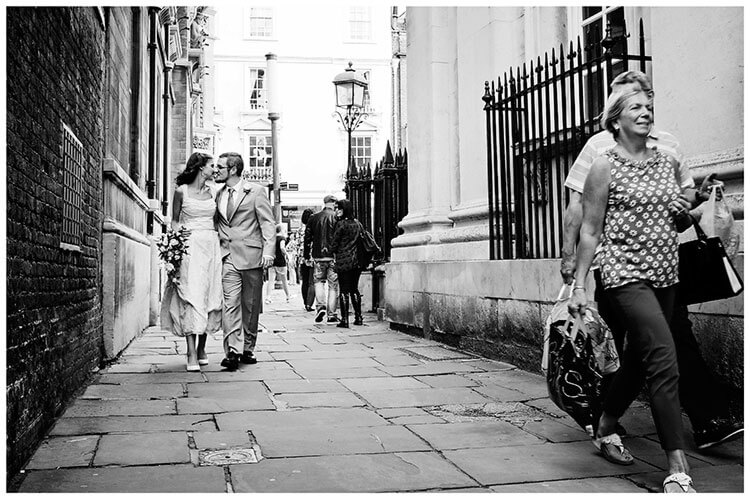 Michaelhouse wedding bride groom share kiss on streets Cambridge