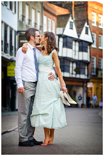 Michaelhouse wedding bride groom kiss on cambridge street bride holding shoes