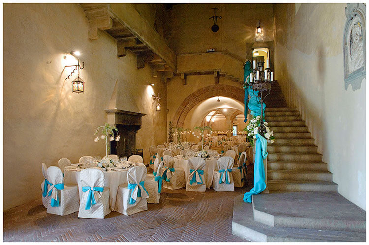 Castel di Poggio wedding venue interior decorated in blue ribbon