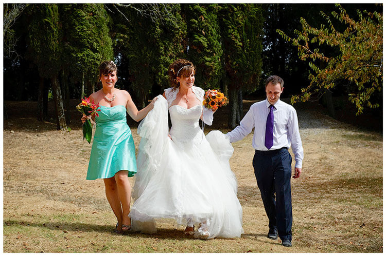 Castel di Poggio wedding bride helped to party