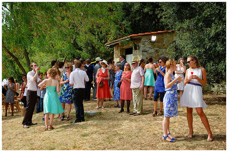 Castel di Poggio wedding guests enjoying drinks conversation