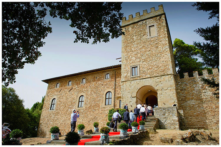Castel di Poggio wedding guests going into castle along red carpet