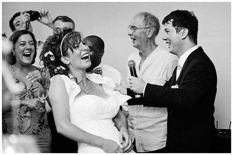 Castel di Poggio wedding laughing bride during grooms speech