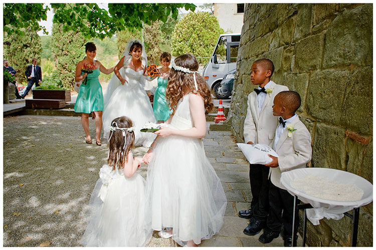 Fraternita di Romena wedding bride greeted by bridesmaids paige boys
