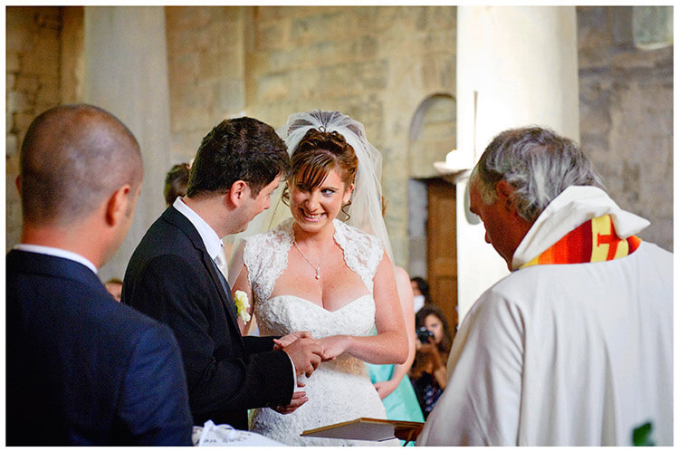 Fraternita di Romena wedding smiling bride exchange rings