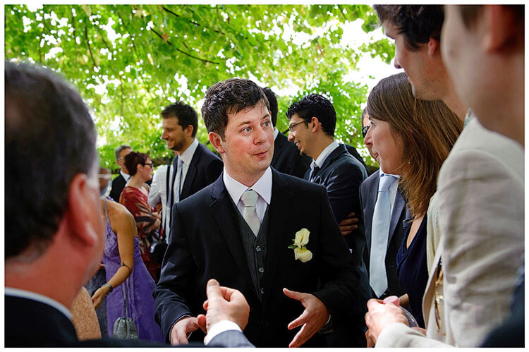 Fraternita di Romena wedding groom talking to guests