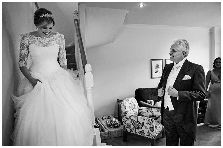 Woburn Inn wedding bride comes down stairs watches by her happy father