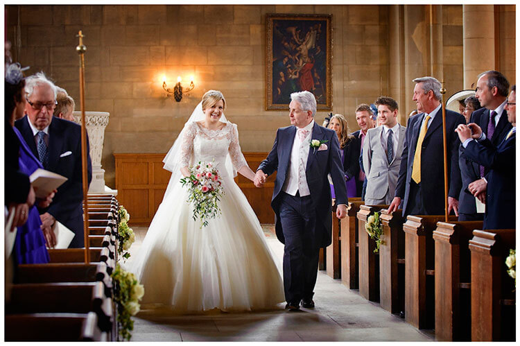 Woburn Church wedding bride walking down aisle holding hands with father