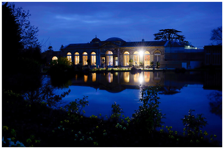 Woburn Sculpture Gallery wedding venue at night reflected in water