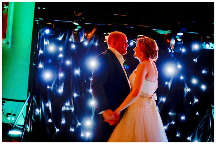 Woburn Sculpture Gallery wedding couple dance in front of disco lights