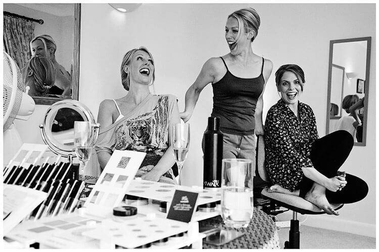 Wedding Photography at Tattersalls bride bridesmaids laughter as they get ready