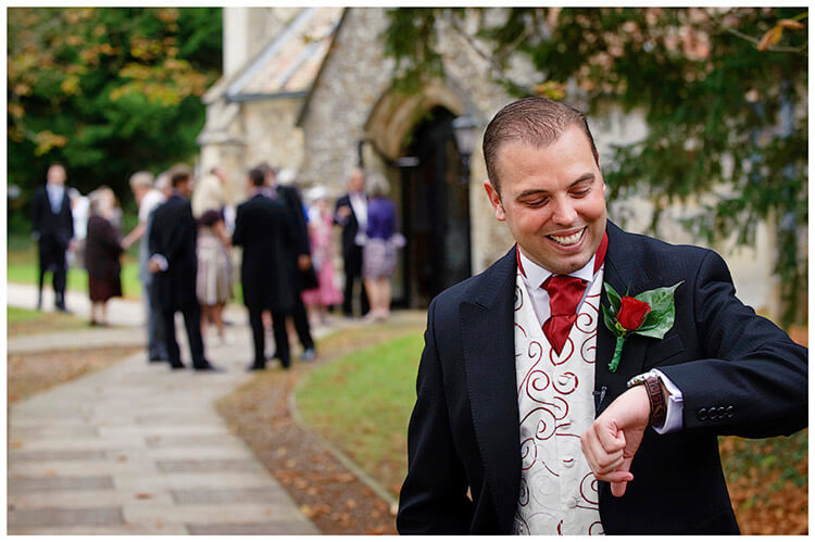 Wedding Photography at Tattersalls groom checks time