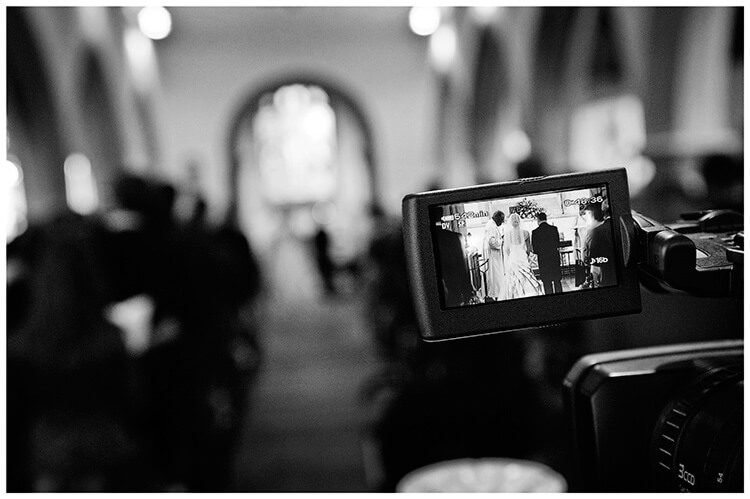 Wedding Photography at Tattersalls bride groom during ceremony through video view finder