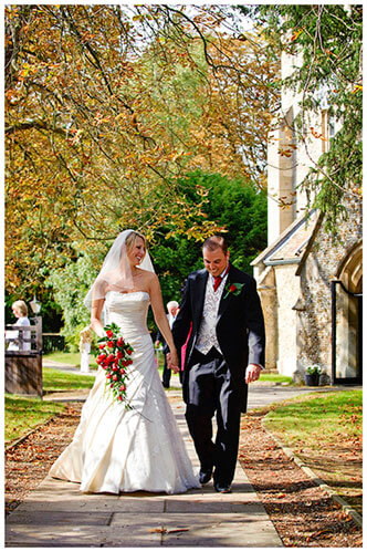 Wedding Photography at Tattersalls bride groom in church yard
