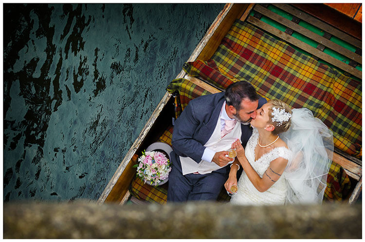 Choosing your perfect wedding photographer bride groom in punt kiss