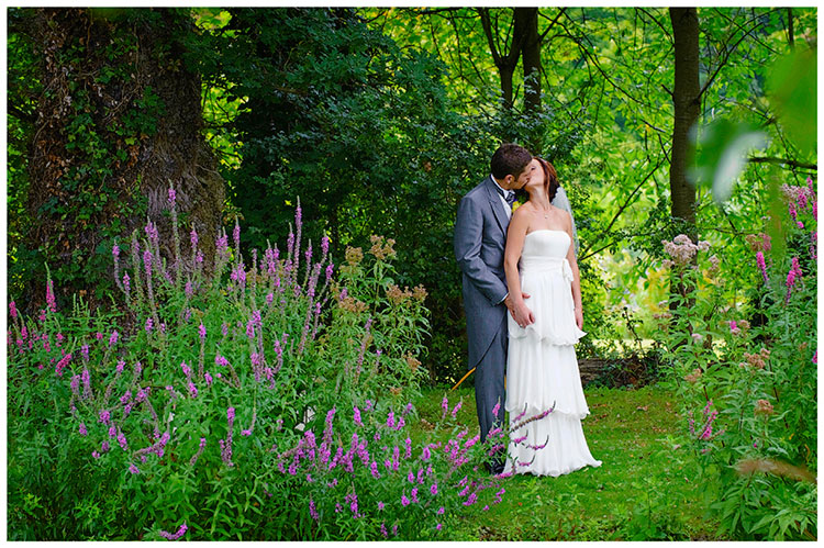 Sheene Mill wedding bride groom kiss in gardens