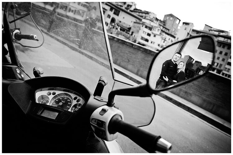 Pre-Wedding Photography in Florence couple embrace reflected in scooter mirror