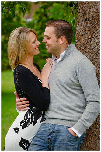 Pre-Wedding Photography shoot in Cambridgeshire loving glance couple leaning against tree