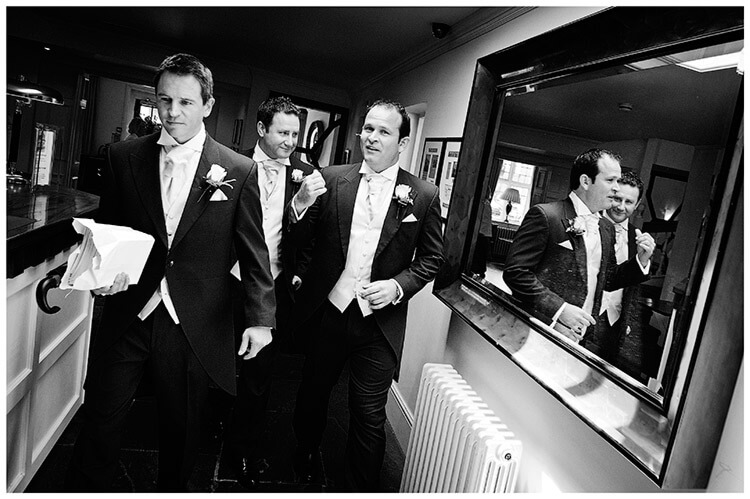 Buckden Church wedding groom ushers reflection