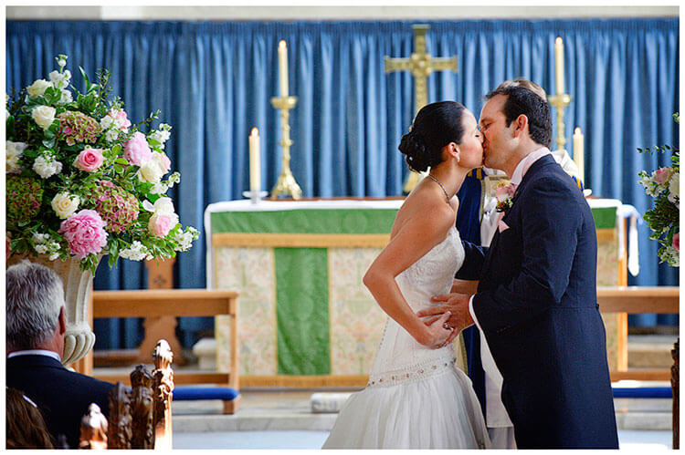 Buckden Church wedding bride groom kiss after ceremony