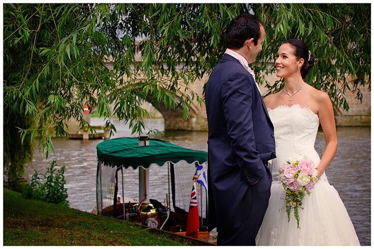 The Old Bridge Hotel wedding bride groom next to river in front of boat