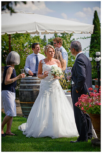 bride talking to guests in garden