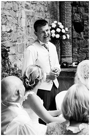 groom laughing during his speech