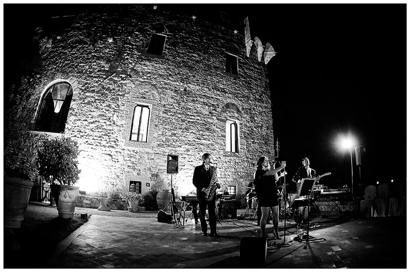 Band plays music in front of Castello di Vincigliata