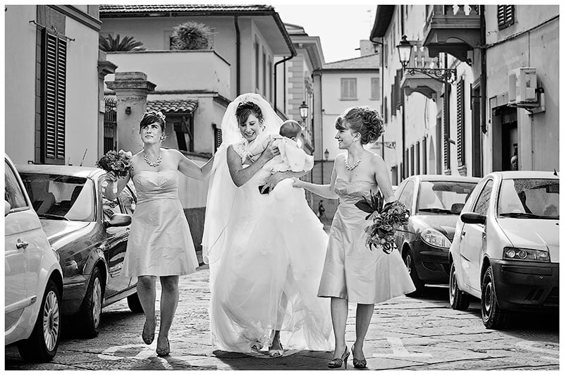 bride bridesmaids walking down Italian Street