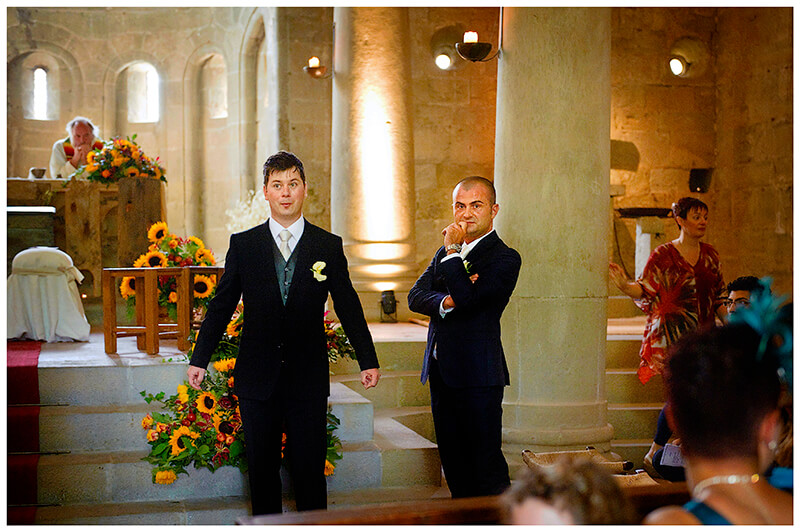 Fraternita di Romena Tuscany groom waits nervously in church with groom