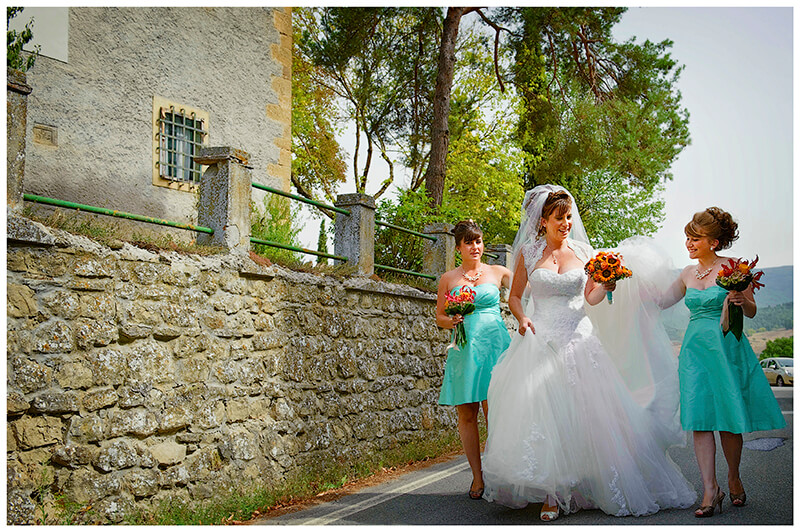 Fraternita di Romena Tuscany bridal party walking down road to church