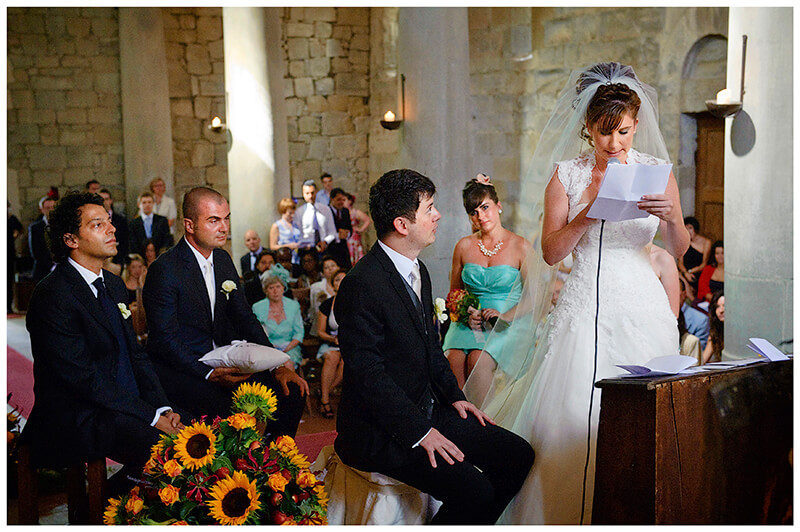 Bride reads vows Fraternita di Romena Church Tuscany 