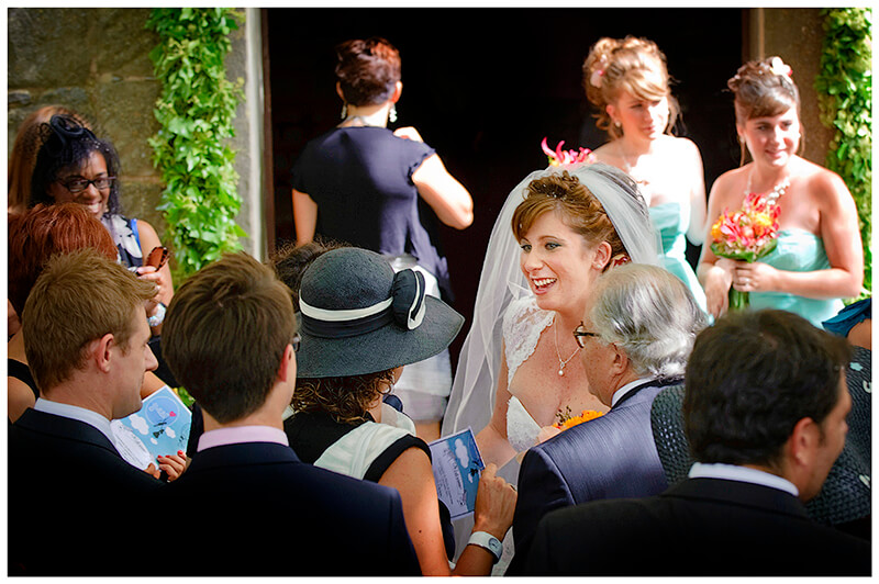 Fraternita di Romena Tuscany smiling bride greets guests