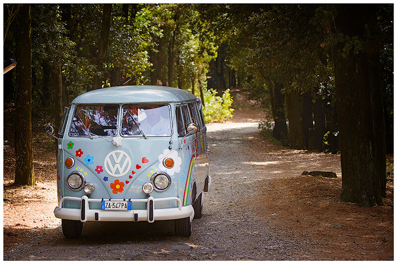 Tuscany Wedding VW Camper Van arrives at Castel di Poggio with bride and groom
