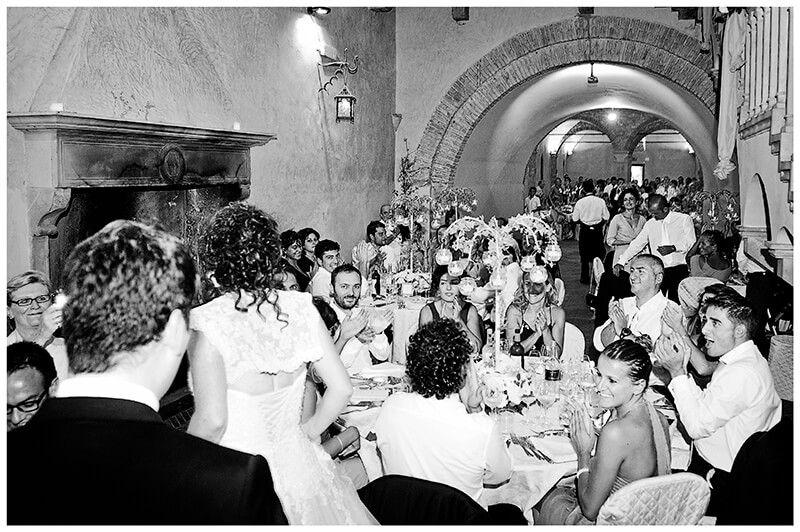 Guests appluad arrival of bride groom in dining room of Castel di Poggio Tuscany Wedding venue