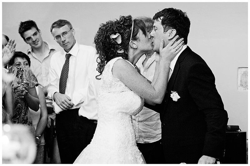 Bride kisses groom after his speech