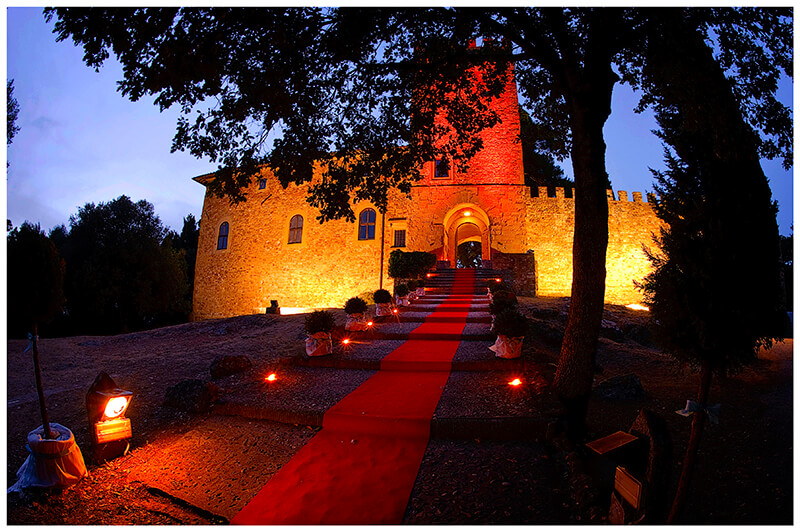 red carpet leading to enterance of Castel di Poggio Tuscany Wedding venue at night