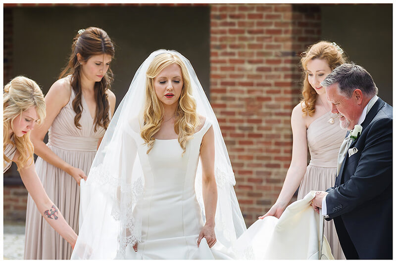 Nervous looking bride with bridal party 