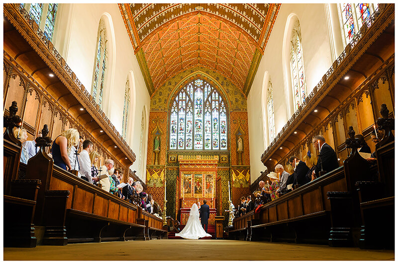 inside the Grand Queens College Chapel wedding Cambridge