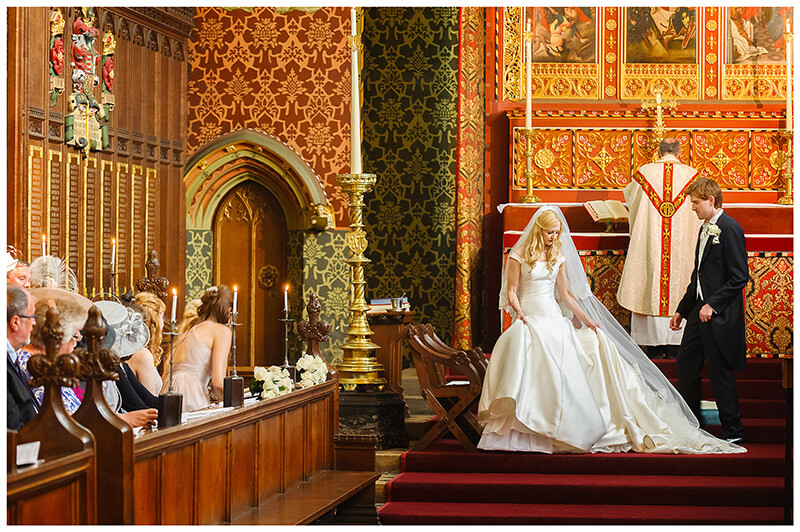 Bride groom at alter Queens College chapel wedding Cambridge
